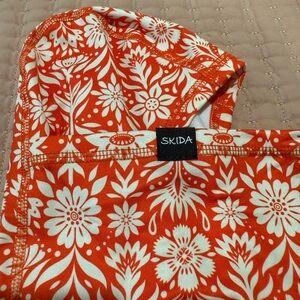 New Skida Orange and White Floral ski neck warmer